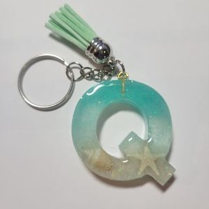 Initial Q beach themed key chain.